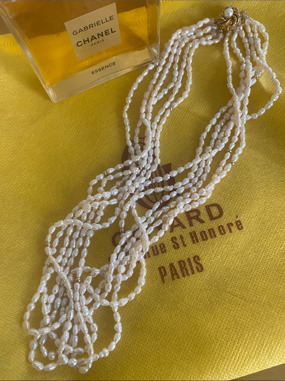 White Multi-Strand Pearl Necklace by the mother of pearls sea.